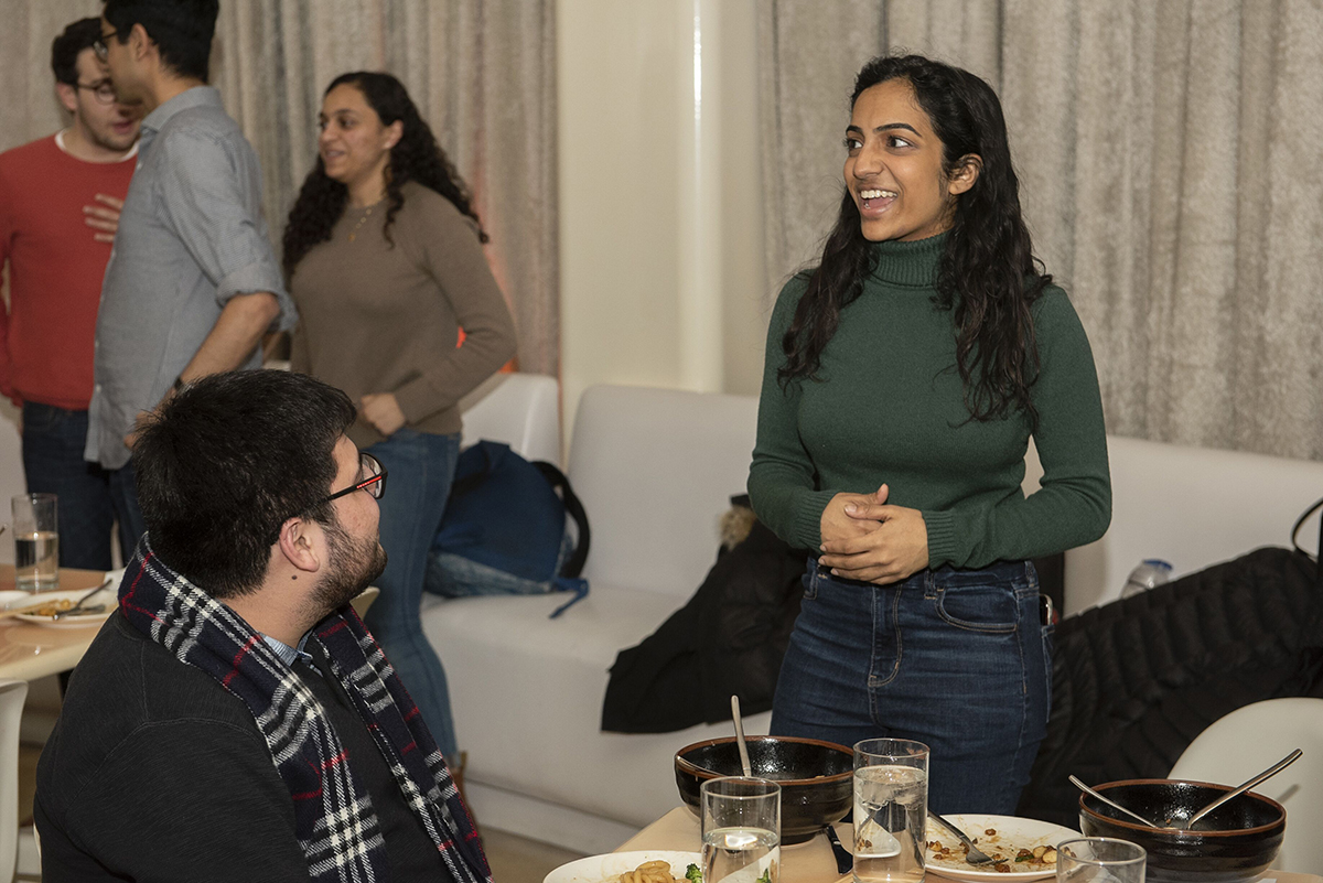 Natasha Menon talks with students at the UA Dinner