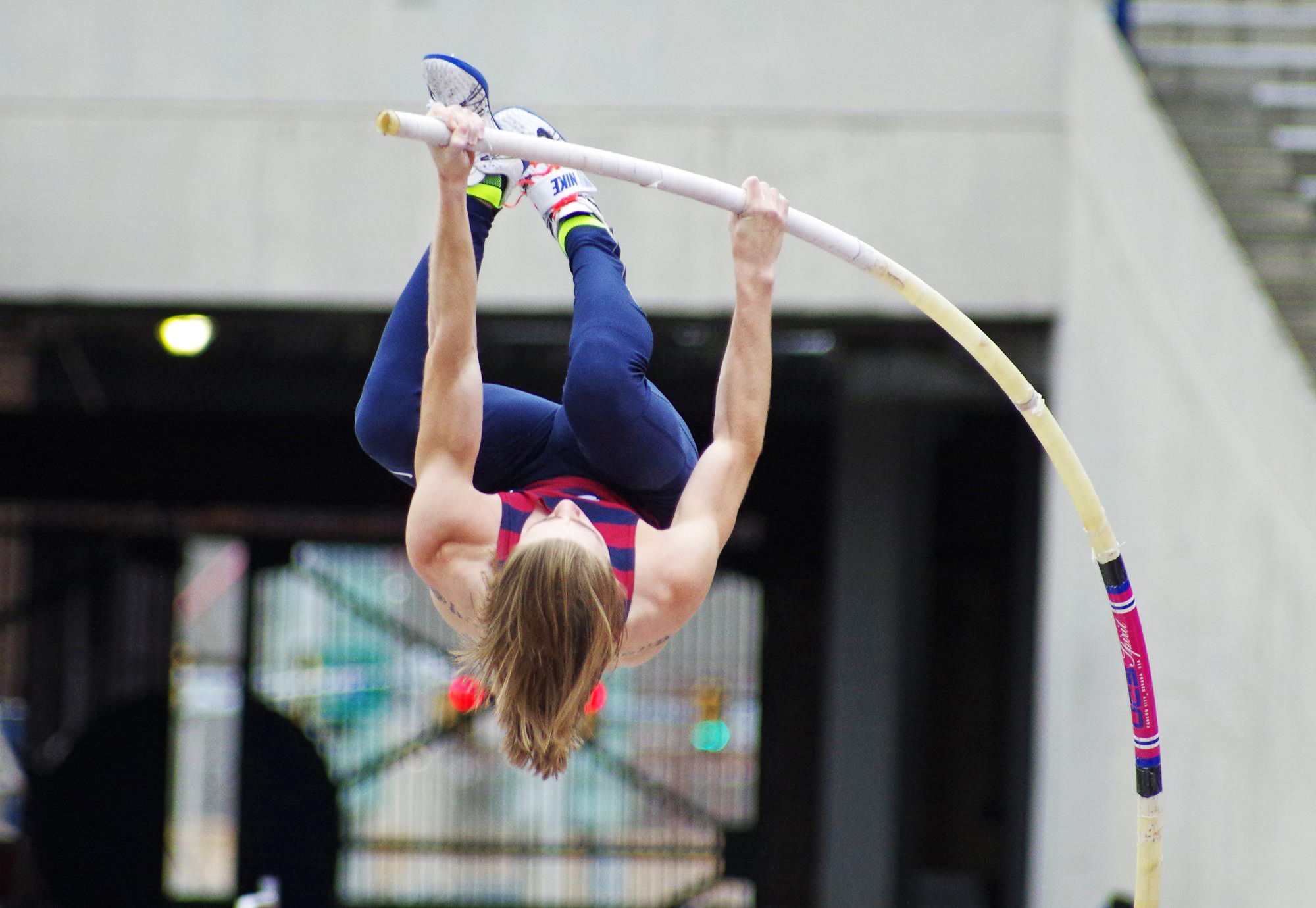 Sean Clare of the Penn Track and Field team performs the pole vault during a meet.