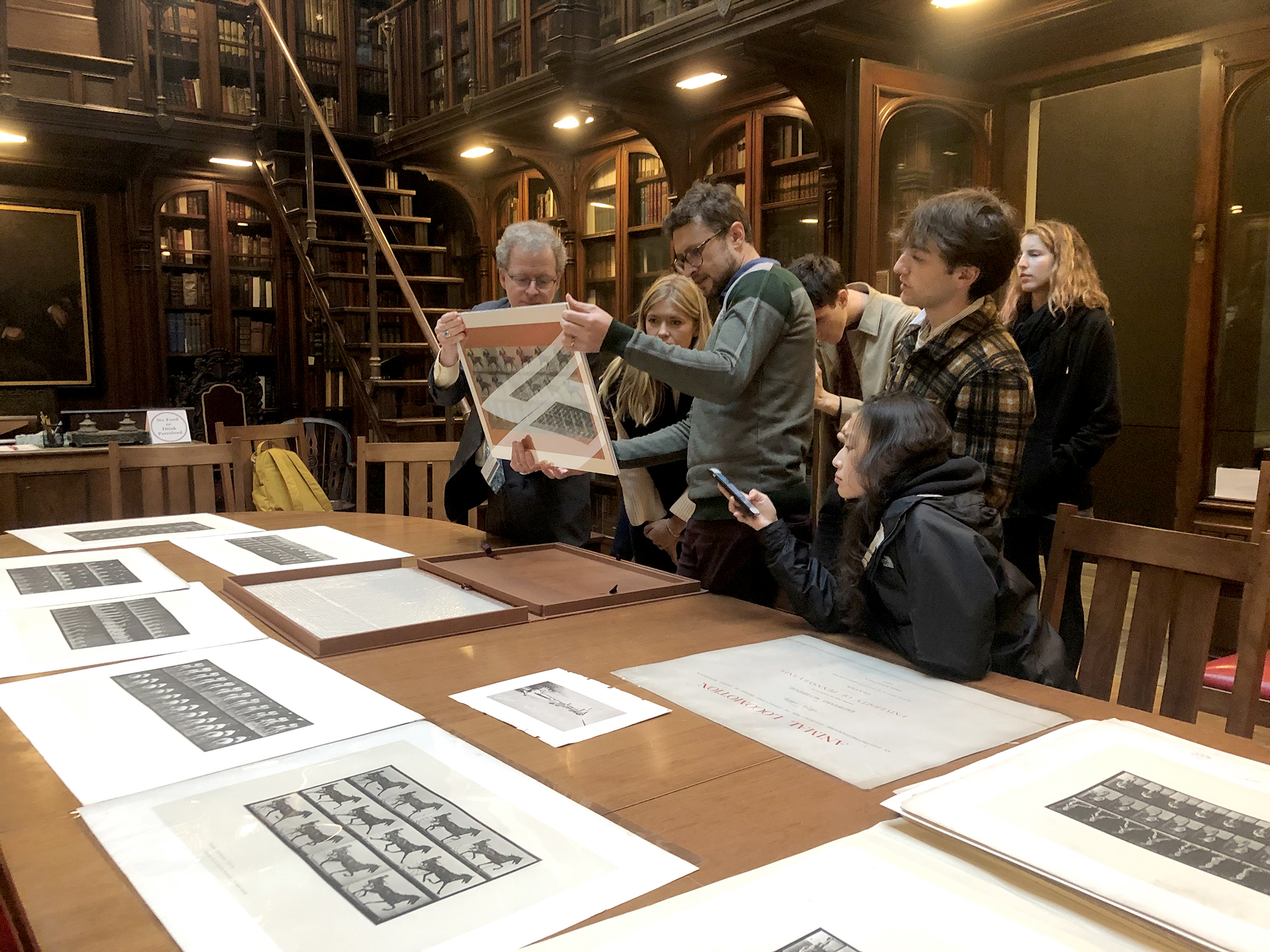 students in lea library looking at muybridge