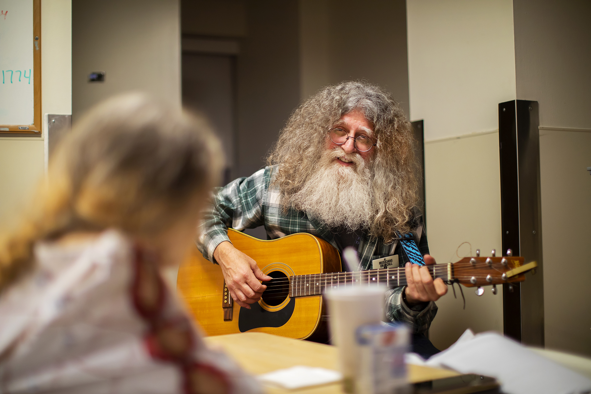 david falcone playing guitar for a patient