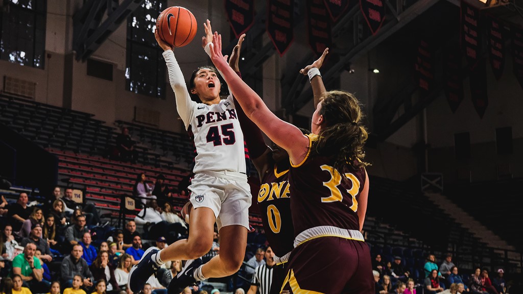 Kayla Padilla shoots a basket during a game