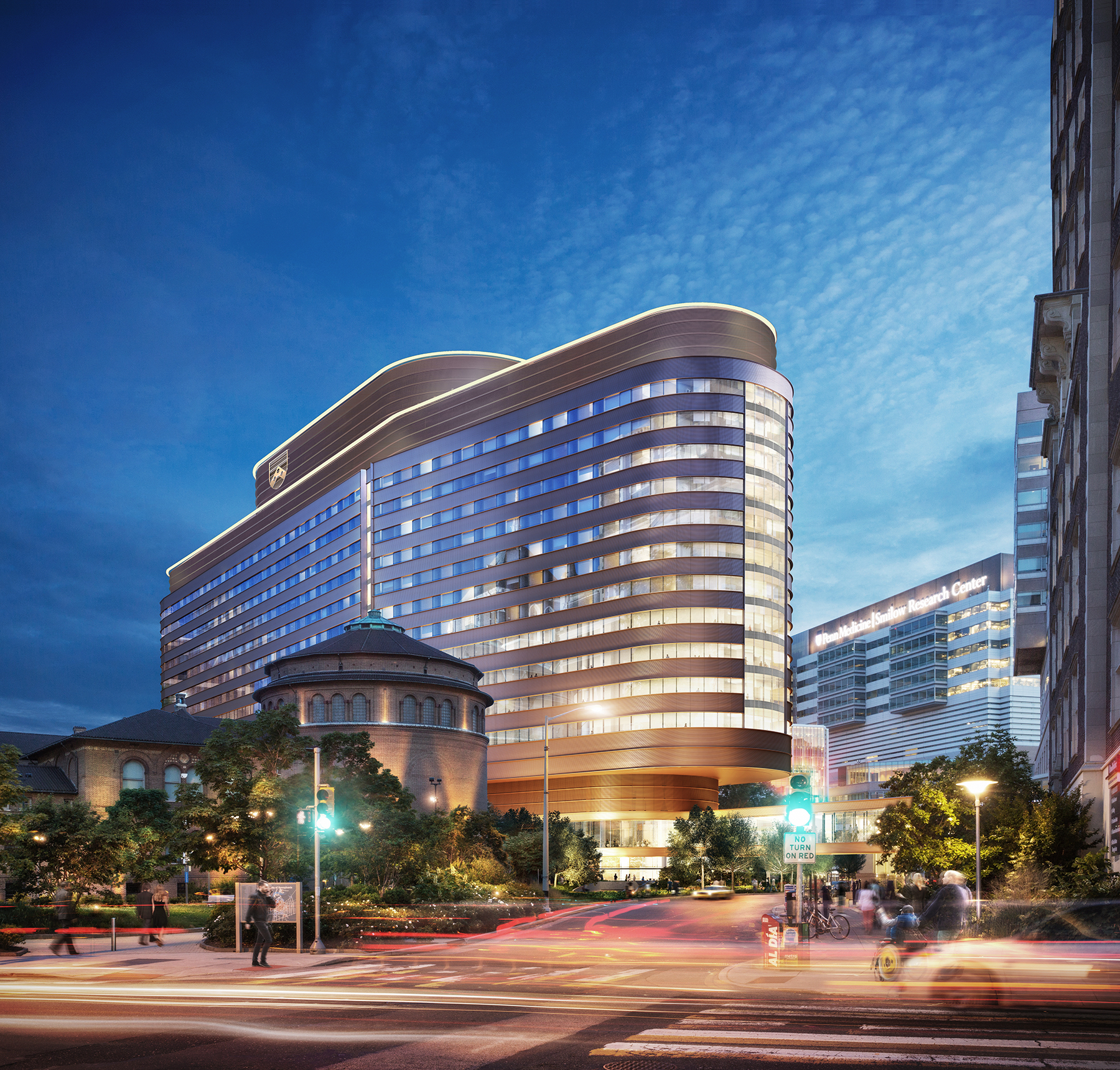 Rendering of the new Penn Medicine Pavilion at dusk with lights on at the Penn Medicine Complex