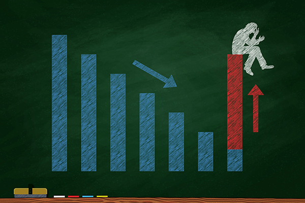 Chalkboard with a bar graph decreasing and a human figure on the last bar spiking in red