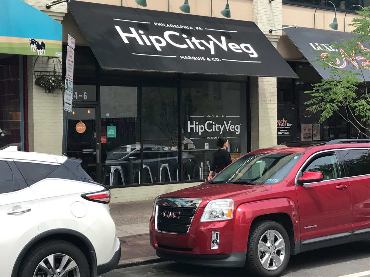View of facade and awning for HipCityVeg on 40th St in daylight.