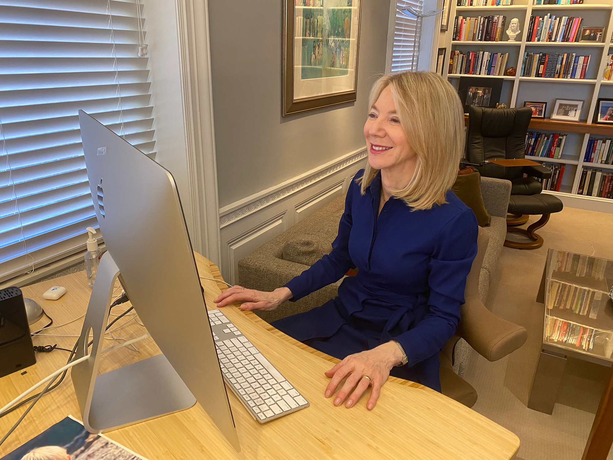 Amy Gutmann sits at her desk during a video online class which she is a guest lecturer.