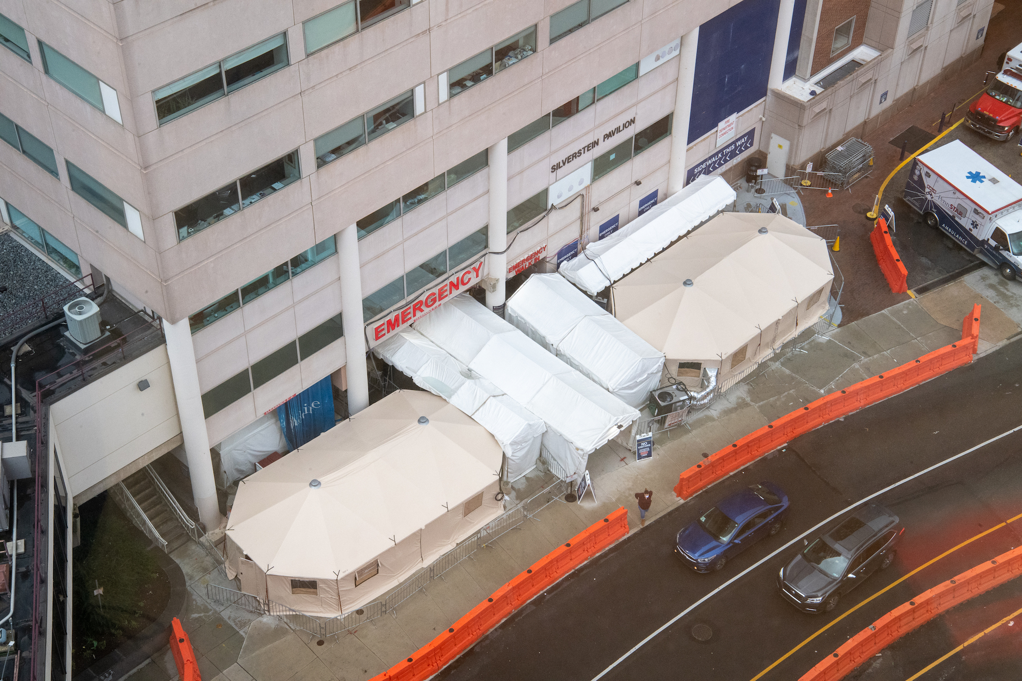 Two large and three small temporary tents outside the Emergency Department at the Hospital of the University of Pennsylvania.