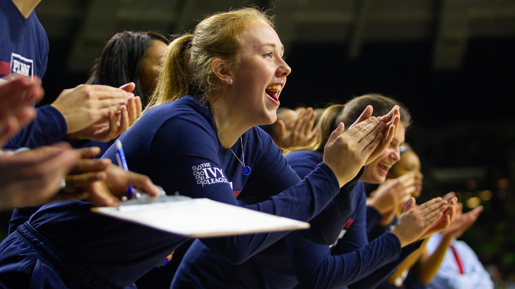 Liz Satter claps for her teammates while sitting on the bench during a game versus Notre Dame.