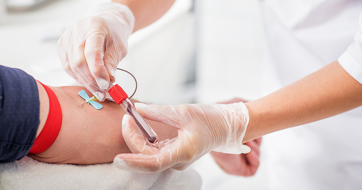 Needle sticking into arm of patient