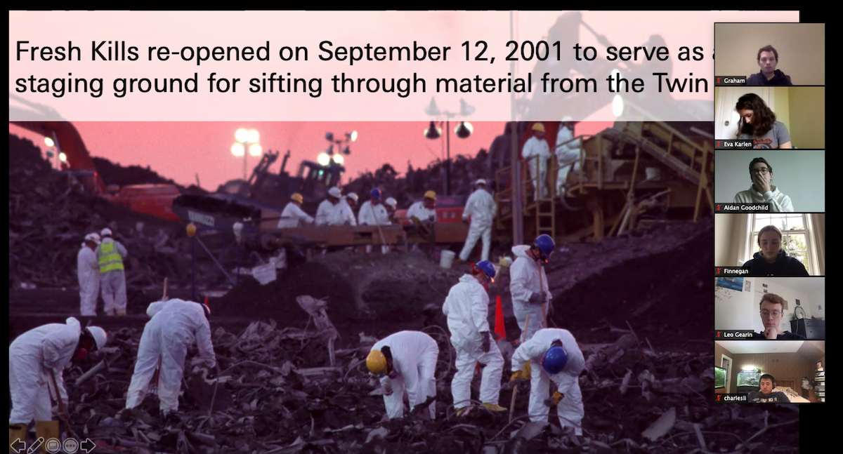 People in hazmat suits sift through debris from the World Trade Center at Fresh Kills Landfill.