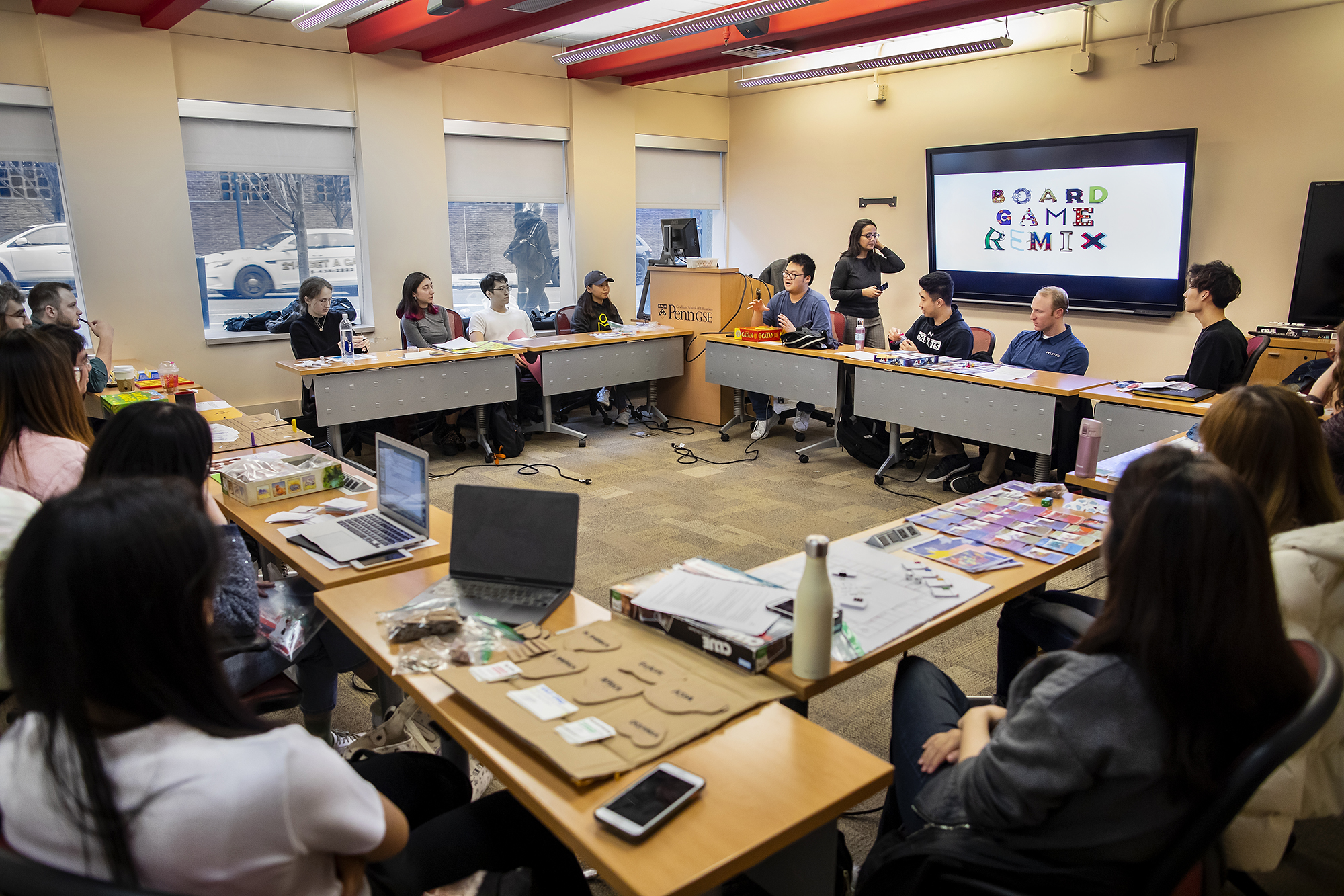 Students set up board games in class