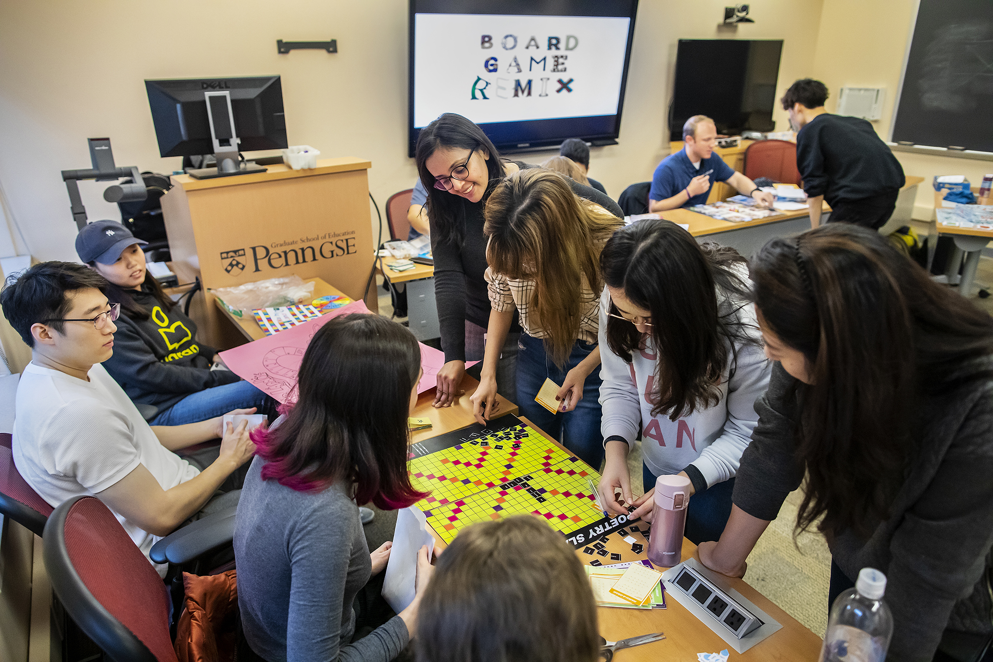Students gather around board games