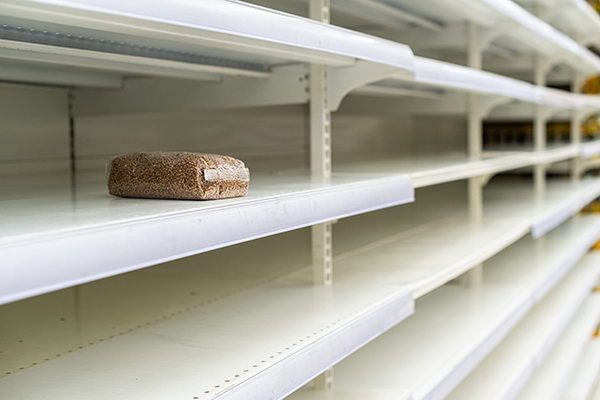 One bag of buckwheat on an empty grocery store shelf