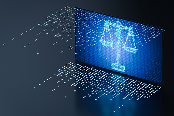 Scales of justice rendered in 1s and zeroes of computer code on a computer screen.