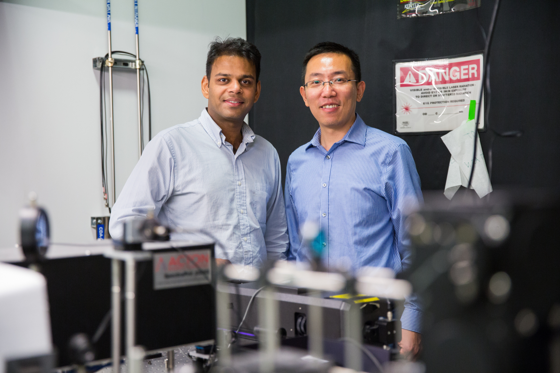 a portrait of ritesh agarwal and liang feng inside of a research lab