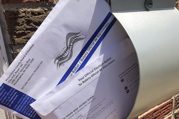 Sealed official mail-in ballot in an open mailbox