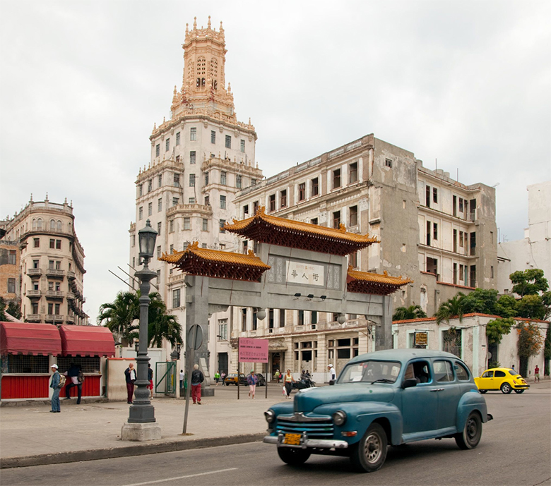1950s-style car in front of Chinese architecture in Havana, Cuba in 1998.