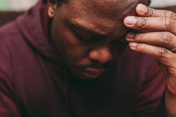 Black man experiencing emotional stress