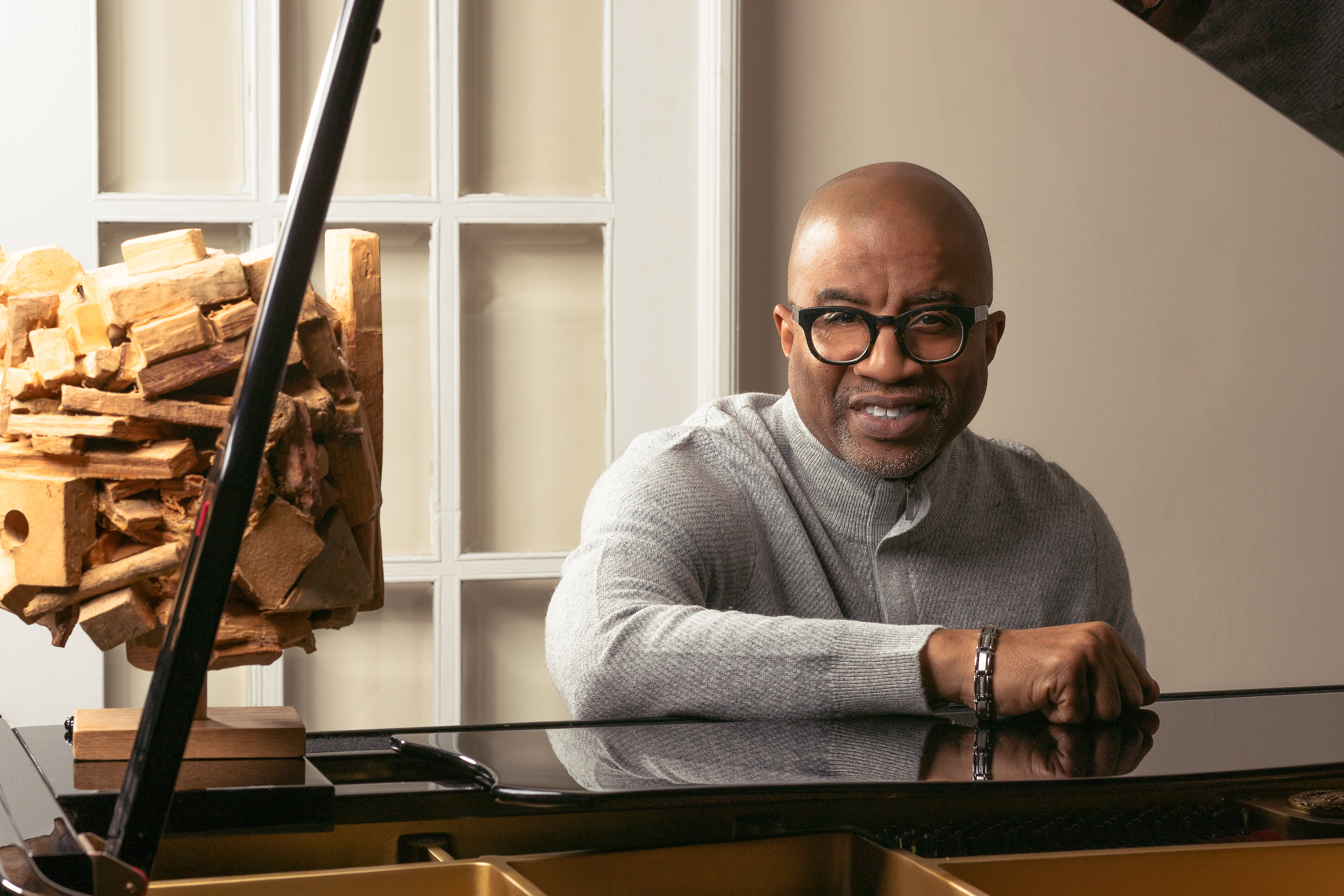 Professor sitting at a piano 