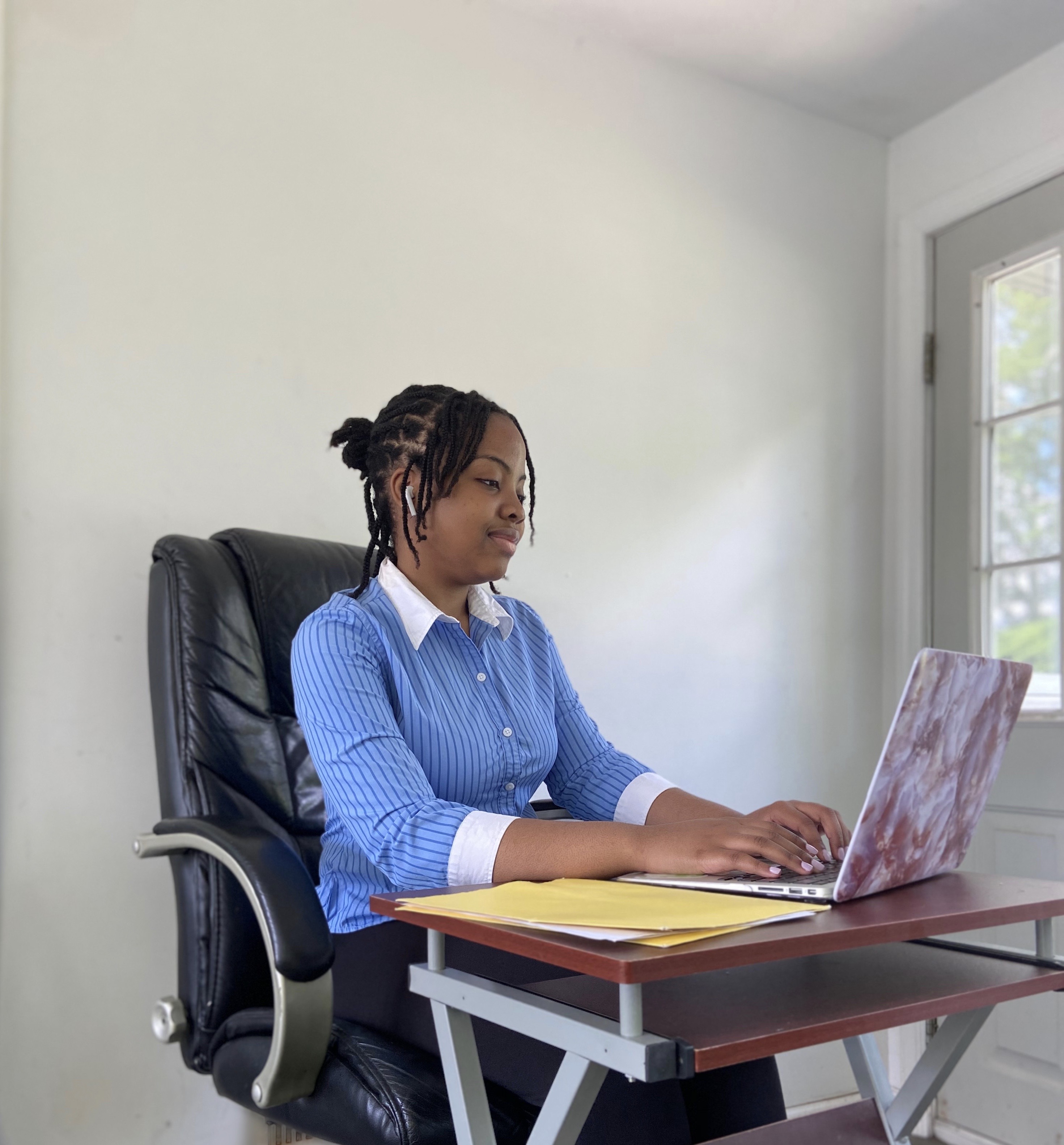 Mary-Pearl Ojukwu, a student at Lincoln University, works at her computer