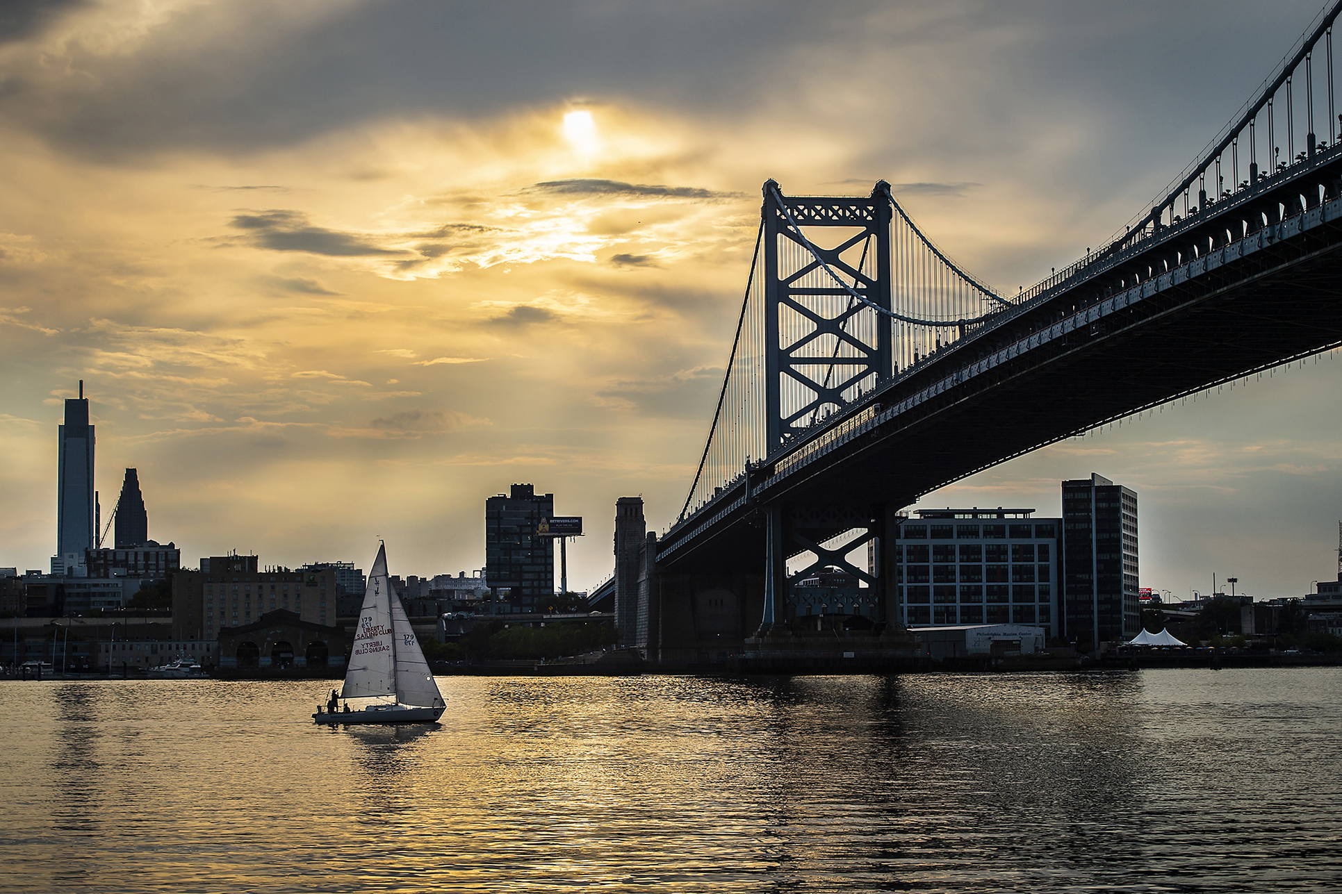 delaware river at sunrise with a boat on the water