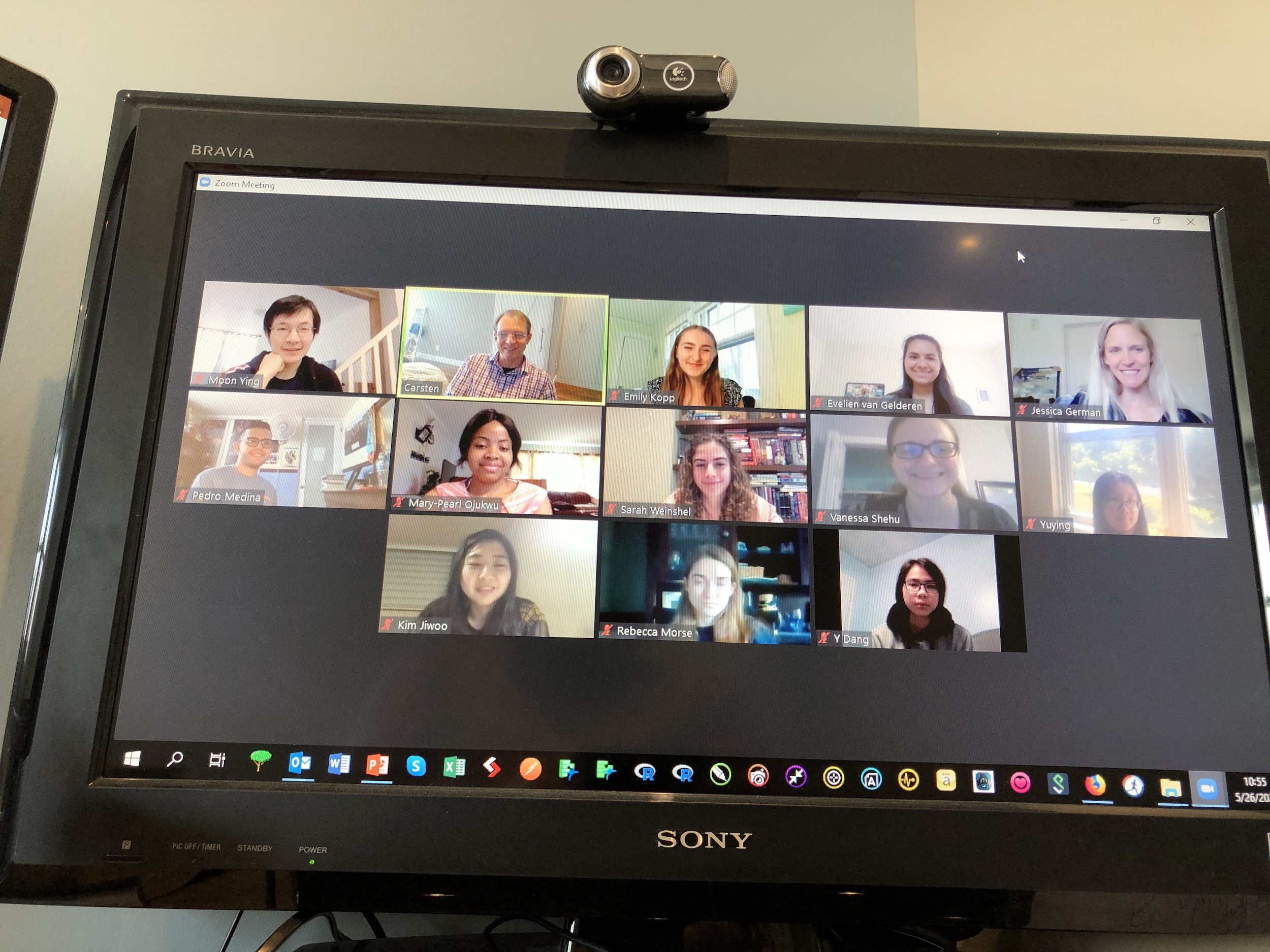 Screenshot of a video call with 13 people