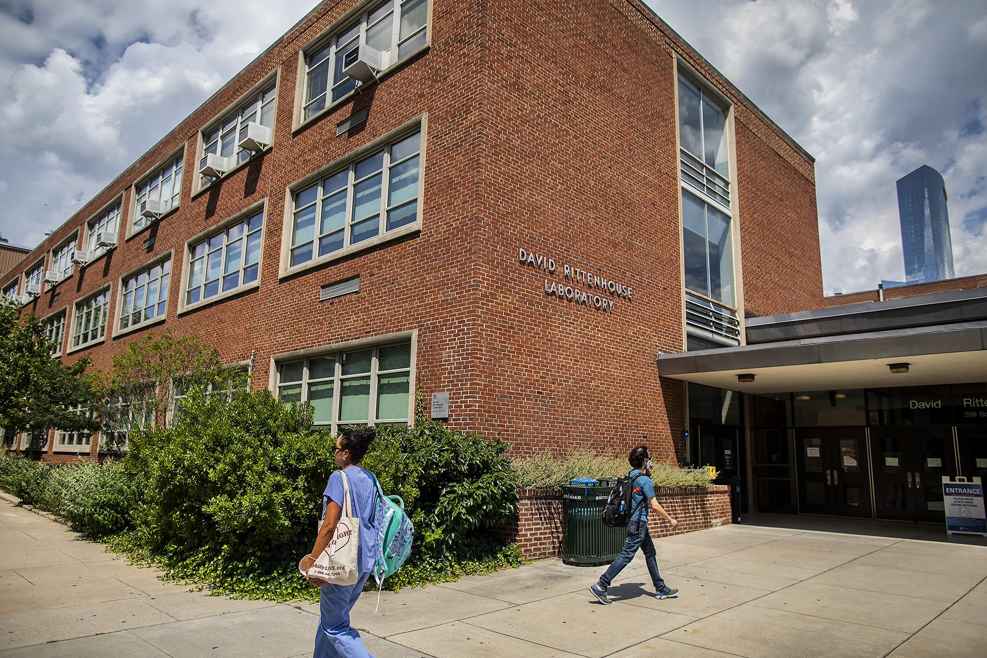 two people walking in front of the david rittenhouse laboratory building