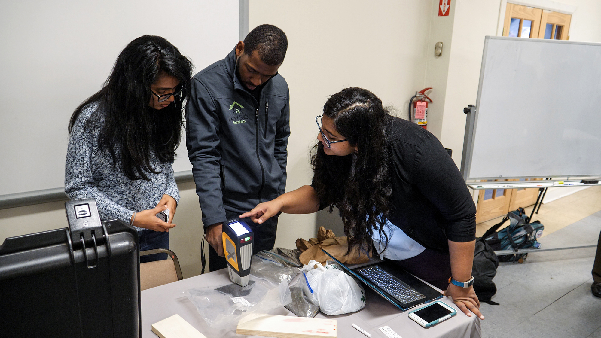 students performing a lead test