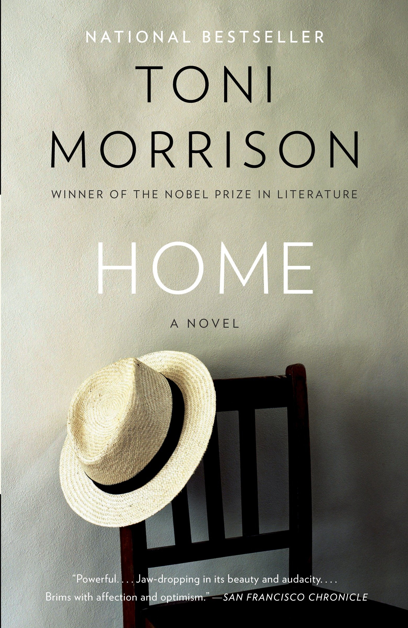 Book jacket of Toni Morrison's home showing a straw hat on a wooden chair.