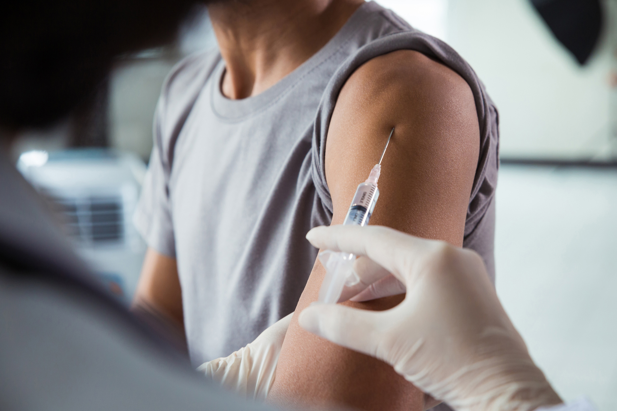 medical professional giving vaccine shot