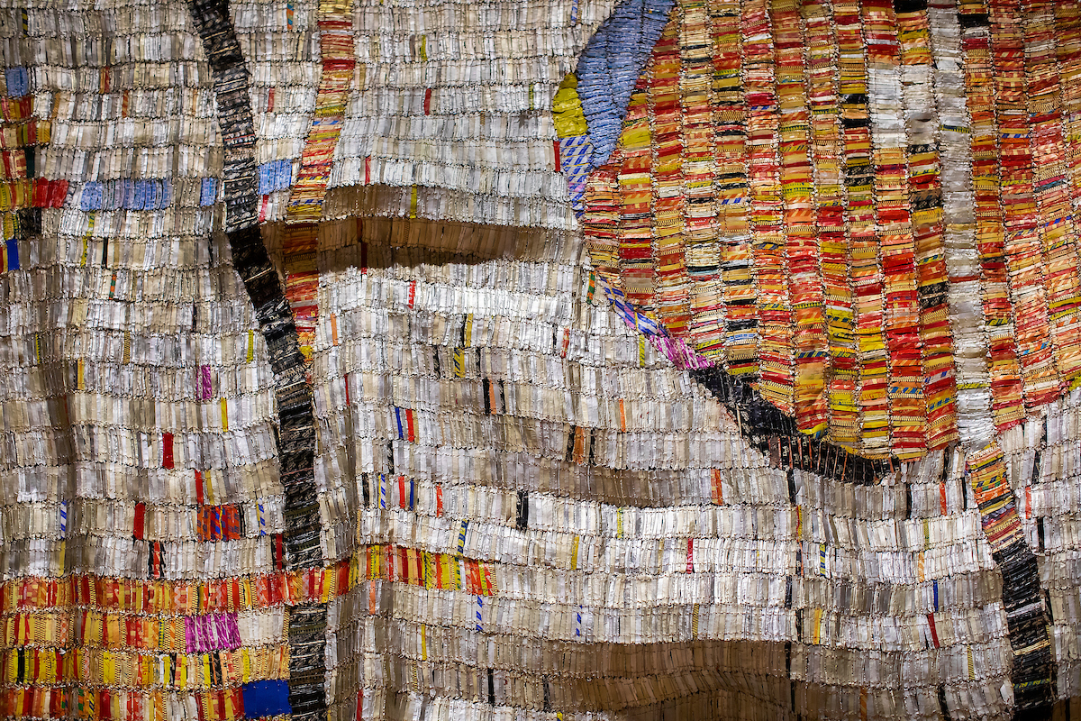 Closeup of artwork made of hundreds of metal pieces from aluminum cans