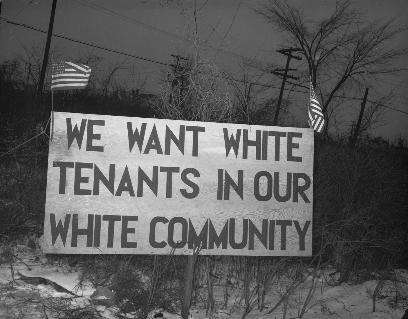 white tenants in white community sign
