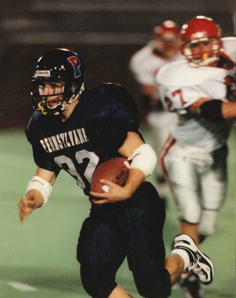 Tim Ortman runs with the ball during a game.