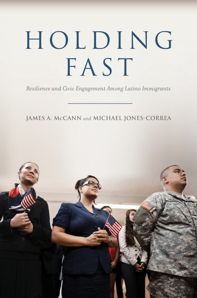 Book cover titled Holding Fast, with a photo of three people standing, one in military uniform, another holding an American flag, all three are Latinx.