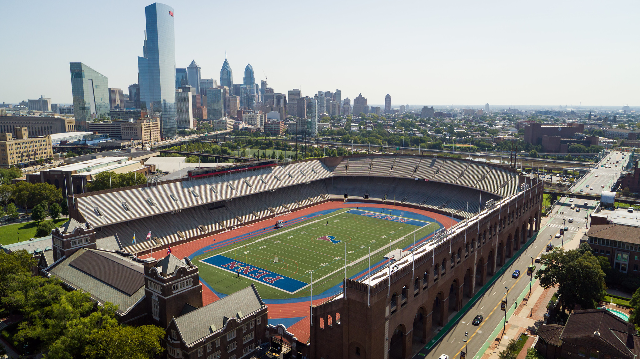 An aerial view of Franklin Field with the Philadelphia skyline in the background.