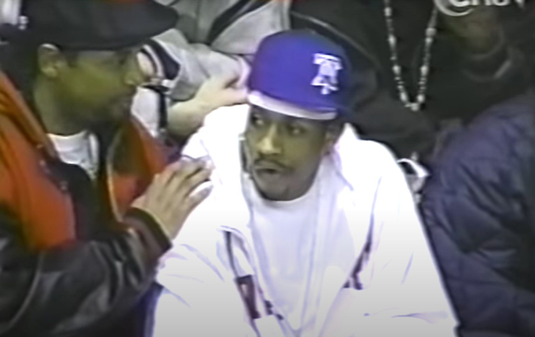 Allen Iverson watches LeBron James play from the stands.