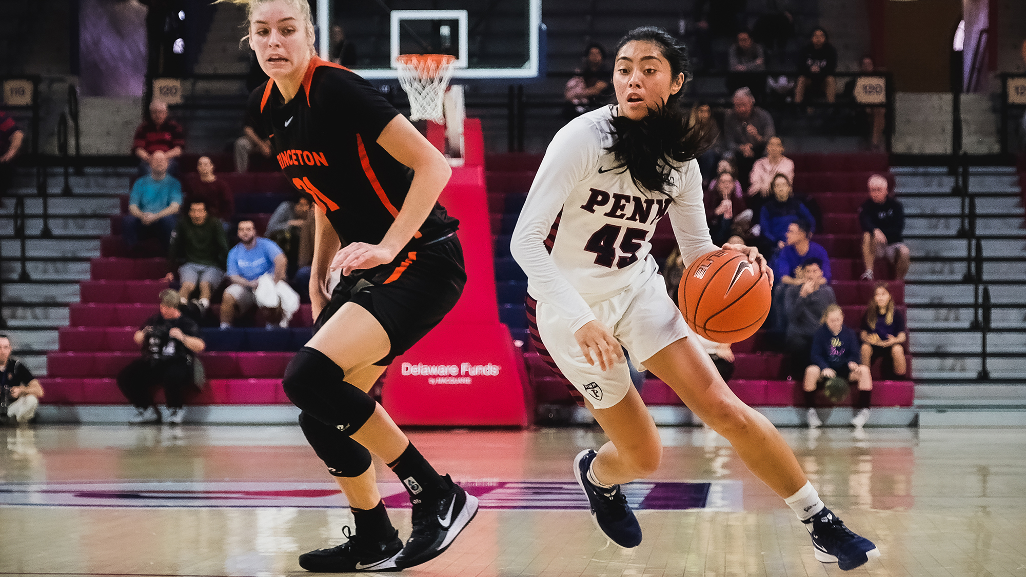 Kayla Padilla of the women's basketball team drives to the basket against Princeton.