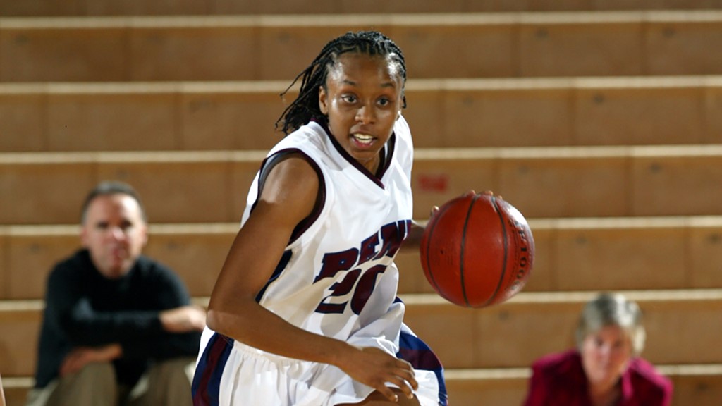 Jewel Clark dribbles the ball up the court at the Palestra.