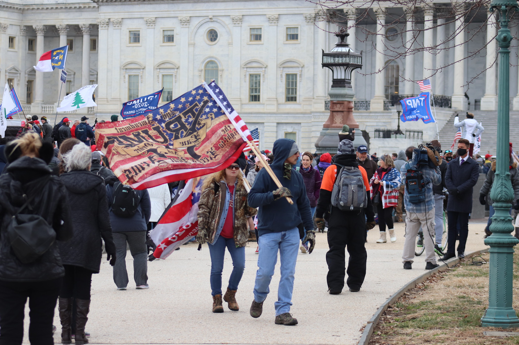 capitol rioters holding flags