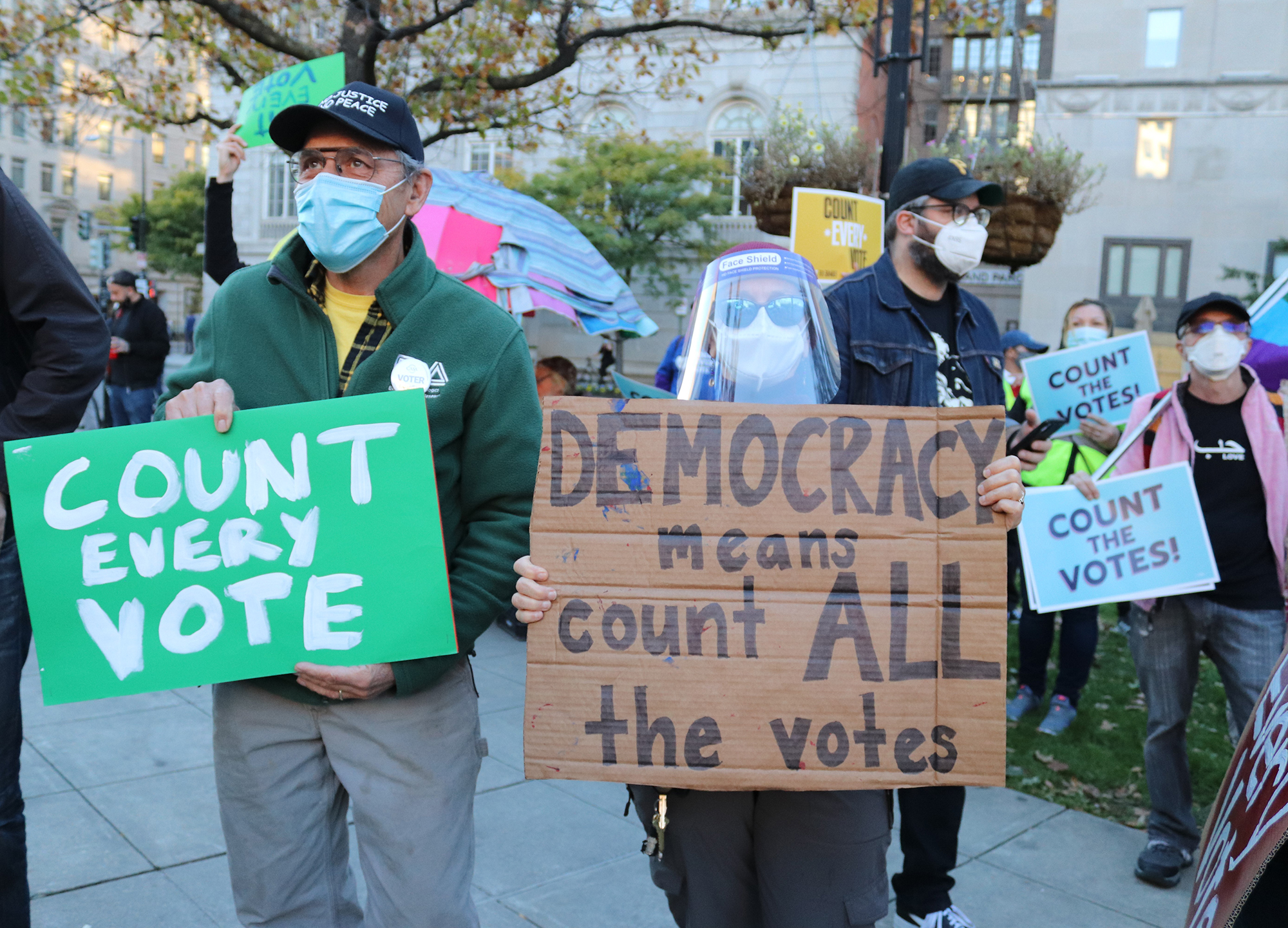 protesters with count every vote signs