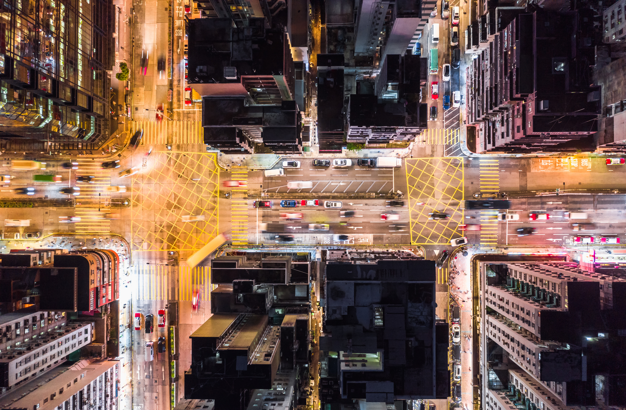 an aerial view of city streets at night