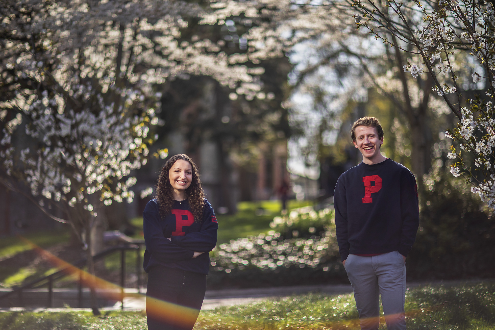 Two students wearing sweaters with the letter P standing outside