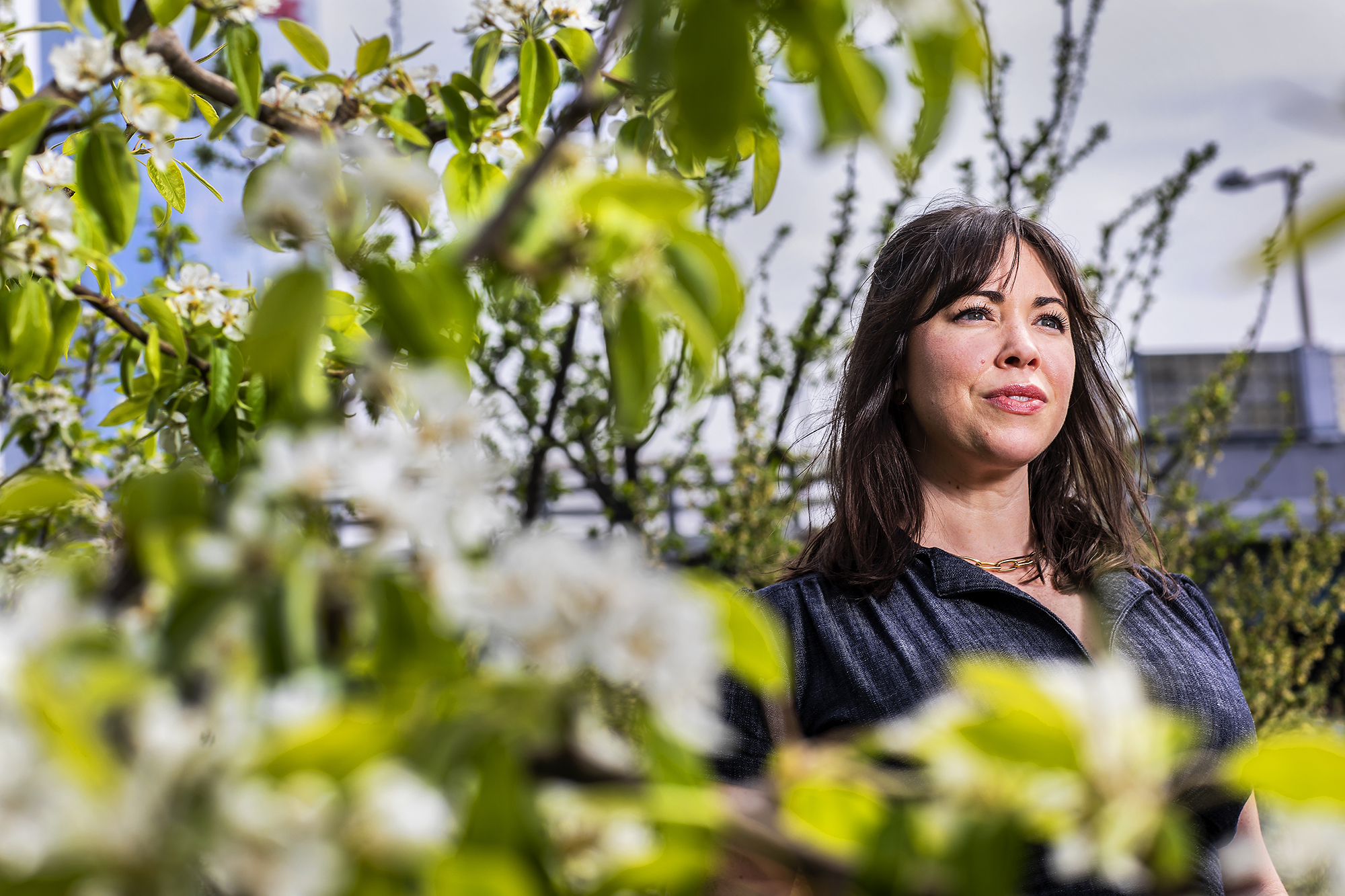 Nina Morris amid flowering trees