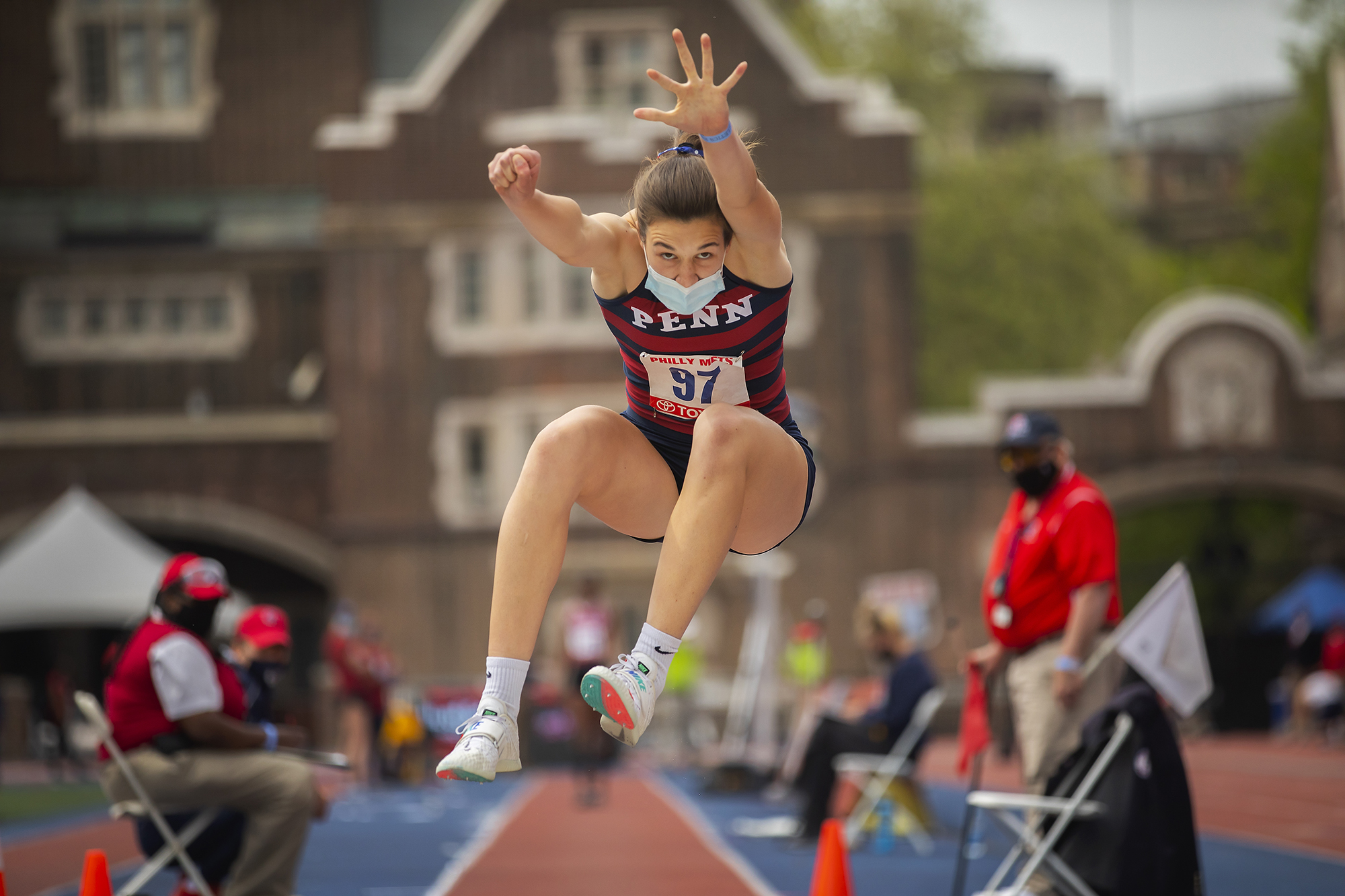 A Penn athlete performs a jump at Franklin Field during the Philadelphia Metropolitan Collegiate Invitational on April 24.