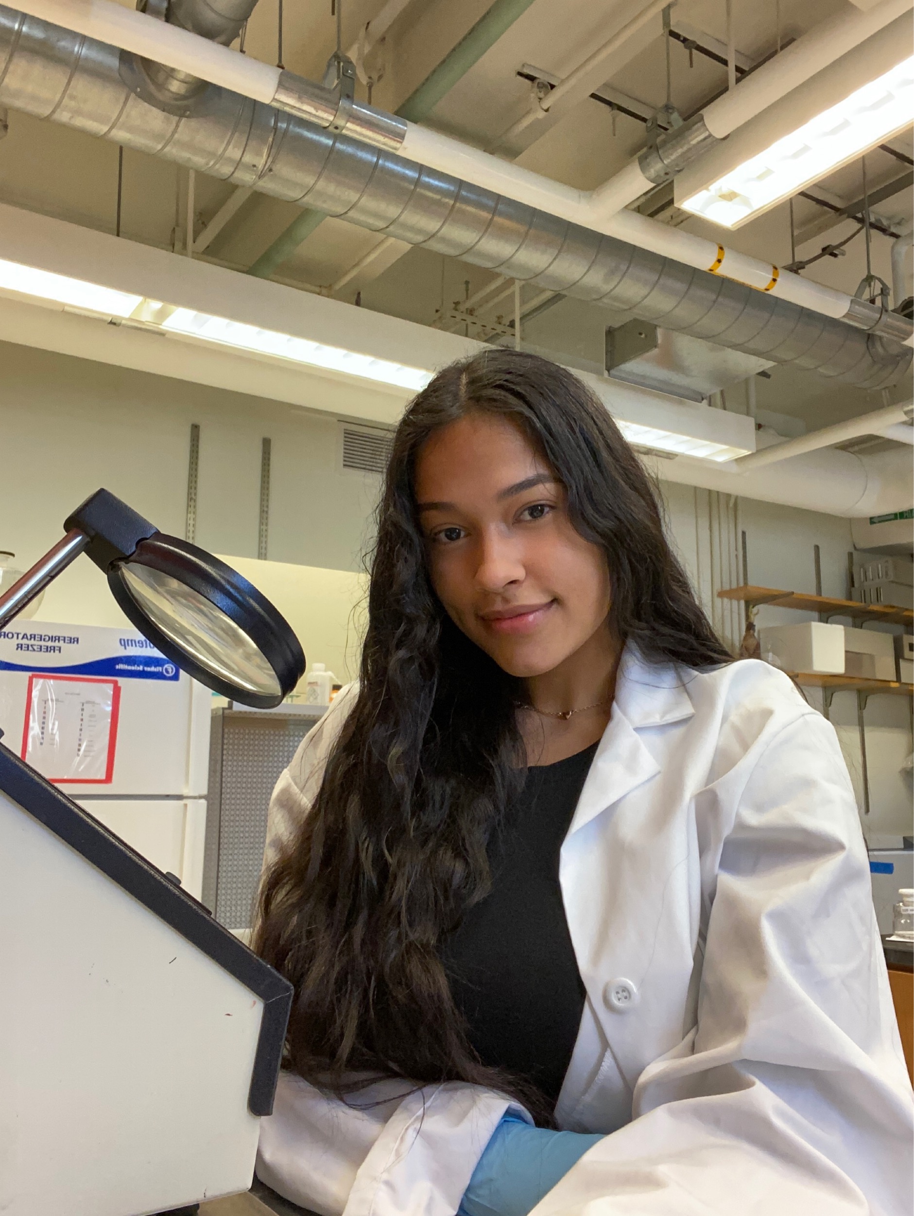 Student Amy Fernandez in a lab