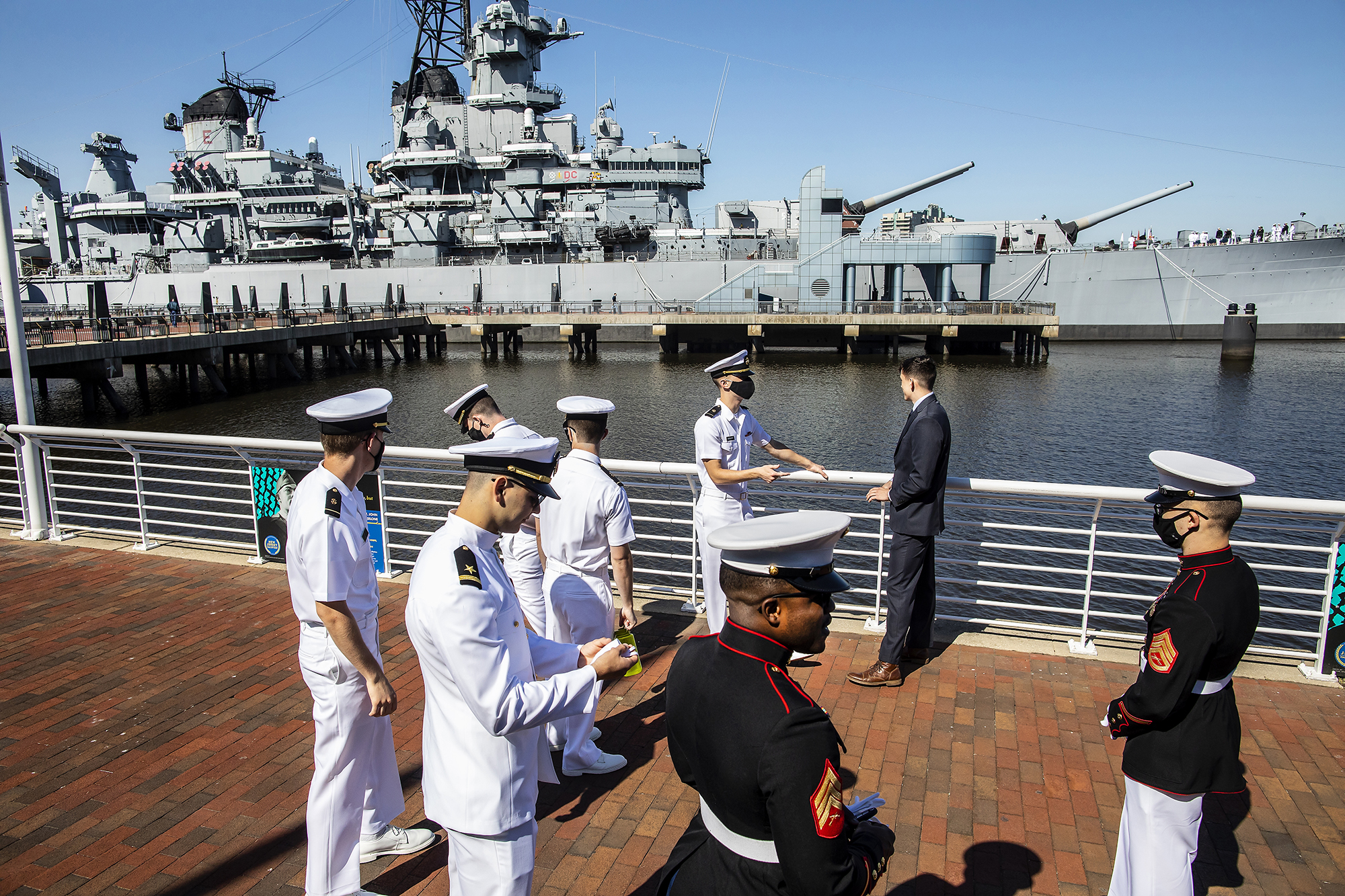Seven people in uniform standing on deck aboard the USS New Jersey.