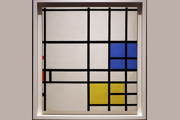  Abstract painting by Piet Mondrian hanging in a gallery.