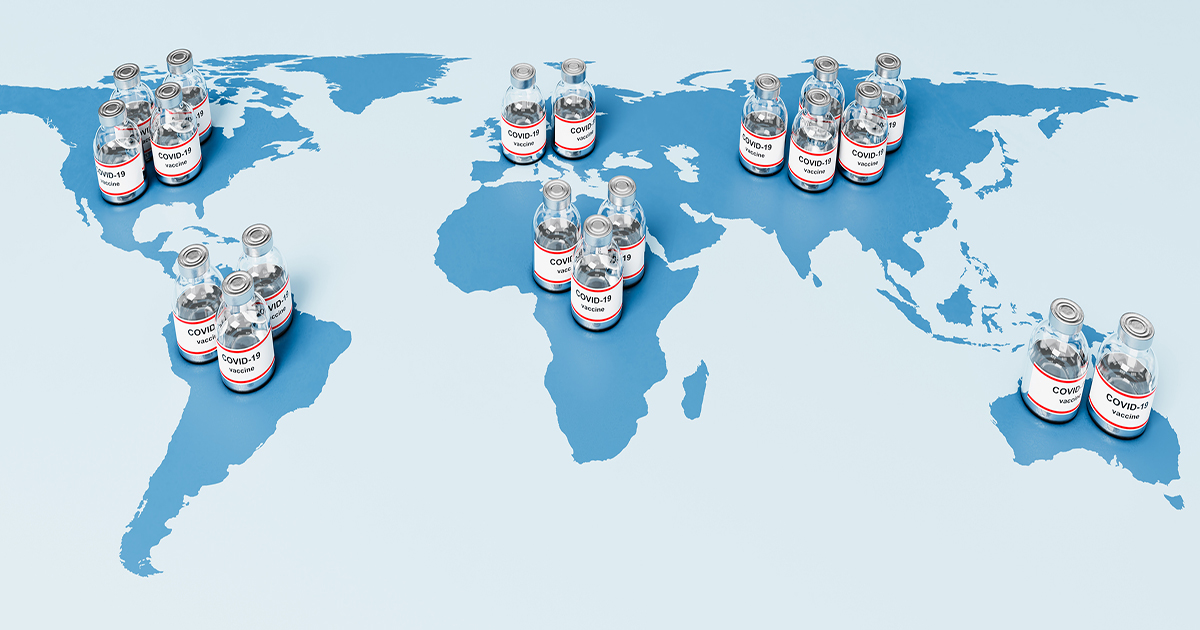 Map of the world with vials of COVID vaccine on top of the map in different countries.