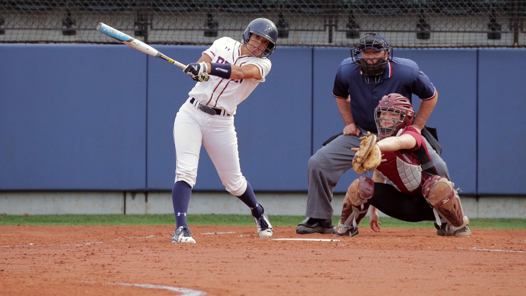 Wearing her white Penn uniform, Leah Allen makes a line drive