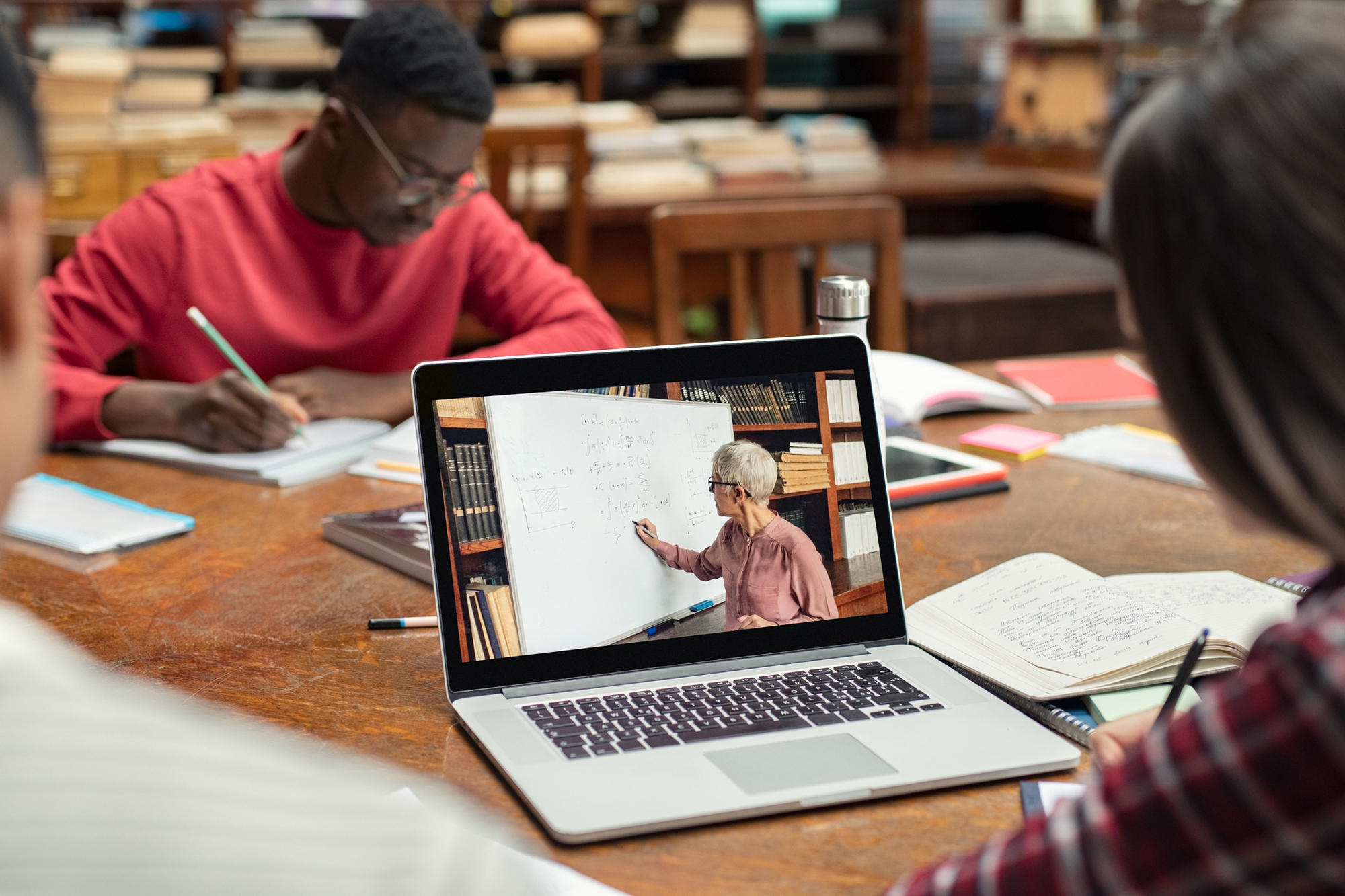 students learning online with laptop 