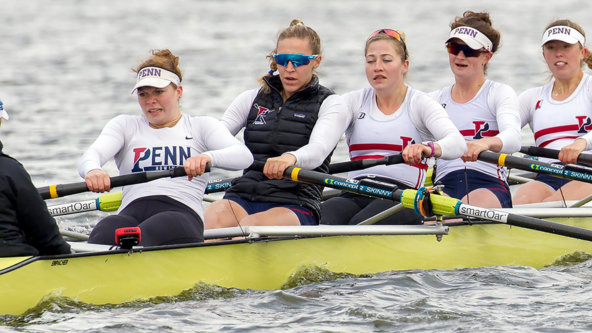 Salmons (in sunglasses) competes with the Penn women’s rowing team during her undergraduate days.